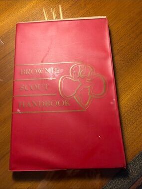 Brownie Scout Handbook - Red with Gold Emblem vinyl cover